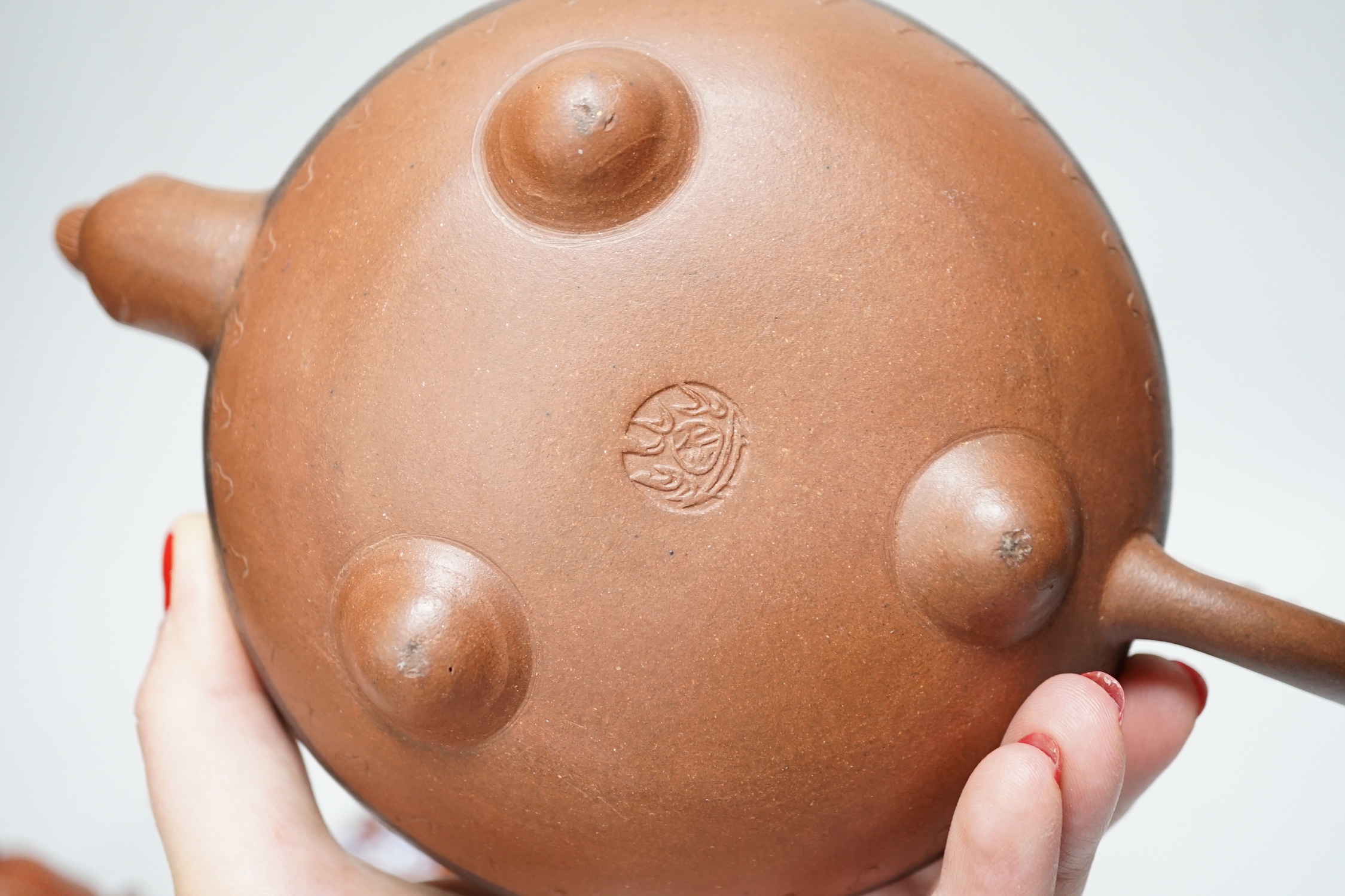 Five early 20th century Chinese Yixing teapots, widest 20cm